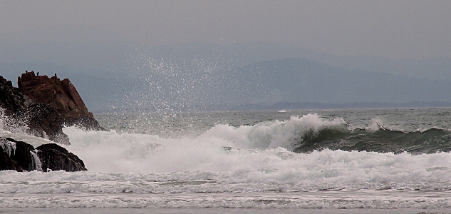 [Powerful waves approximately 3 foot high send water spray about 8 foot high.]